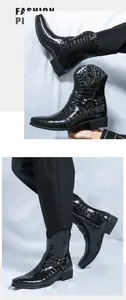 Detail of black embossed faux-crocodile leather boots with metal buckle and side zipper