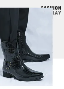 Detail of croc-embossed black leather boot with side zipper and metal buckle accents