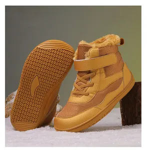 Detail view of children's winter snow boots featuring warm faux fur lining and anti-slip soles