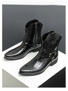 Detail of black crocodile embossed leather boot with metal buckle and side zipper
