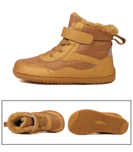 Detail of warm plush lining and non-slip rubber sole on children's winter boots
