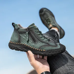 Detail of dark green leather hiking boot with side zipper and rugged anti-slip rubber sole