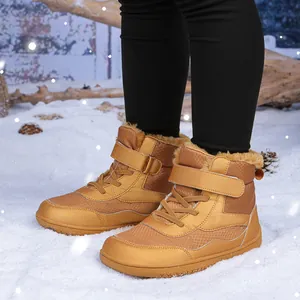 Brown winter snow boots for kids featuring thick fur lining and anti-slip rubber soles