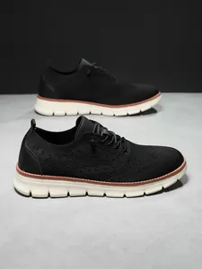 Macro shot of breathable knit mesh upper and brogue detailing on men casual shoes