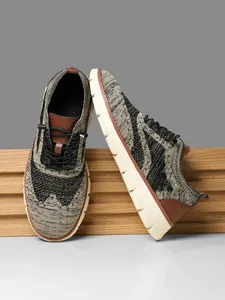 Close-up of breathable knit mesh fabric and traction sole on men's running shoes