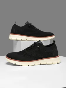Detail of black knit breathable mesh upper and stylish gold buckle on men sneakers