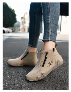 Detail of beige casual women's boots with side zipper and retro 1978 print decoration