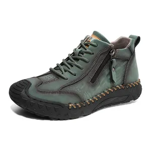 Vintage teal leather high-top men's hiking shoes with side zipper and rugged rubber sole