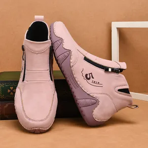 Pink suede high-top casual shoes with hand-stitched details and side zippers
