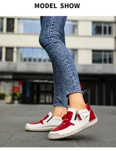 Détails de bottines en cuir rouge et crème avec fermeture éclair et coutures fines