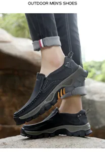 Detail of durable non-slip rubber sole and blue suede upper on outdoor men's hiking shoes