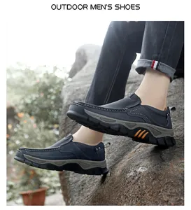 Detail of dark blue outdoor men's casual shoes with orange stripes on thick rubber soles