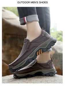 Detail of dark brown leather outdoor shoes featuring side vents and rugged non-slip soles