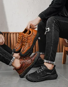 Detailed close-up of handmade stitching and rugged anti-slip soles on casual leather shoes
