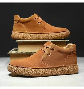 Detailed close-up of khaki suede texture and crepe rubber sole on vintage desert boots