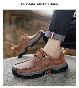 Outdoor men's brown leather shoes with durable rubber soles on natural rock background