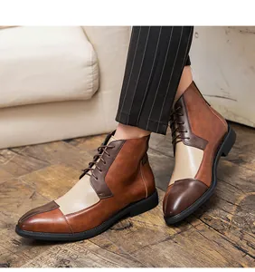 Dettaglio di stivali in pelle da uomo con design a blocchi di colore marrone e beige