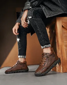 Close-up of brown leather casual shoes featuring handcrafted stitching and thick rubber soles
