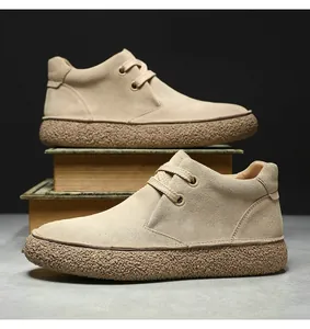 Close-up of khaki suede casual shoes with vintage thick textured gum rubber outsoles