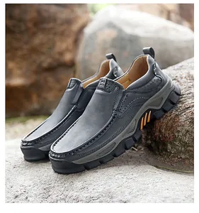 Detail of grey leather slip-on outdoor shoe with rugged non-slip rubber sole