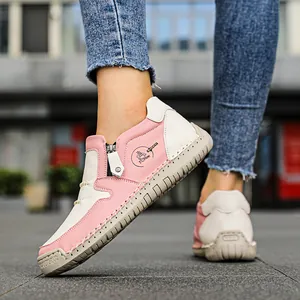 Bottines en cuir rose et blanc pour femmes avec semelle caoutchouc et zip latéral