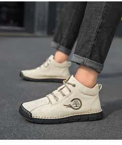 Outdoor shot of men high-top casual shoes featuring hand-stitched rubber soles and soft nubuck