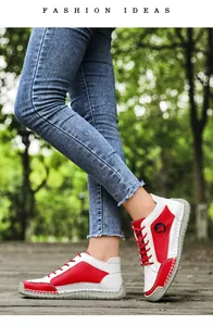 Détail des coutures en cuir rouge et blanc et du logo sur les chaussures basses décontractées