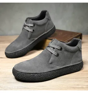 Detail of dark grey suede leather casual shoes featuring non-slip textured rubber soles