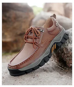 Close-up of brown leather casual shoe showing detailed stitching and durable outdoor sole