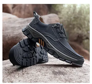 Deep-treaded rubber outsole and contrast stitching on durable outdoor leather shoes