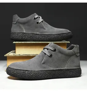 Macro detail of dark grey suede leather texture and thick anti-slip rubber shoe sole