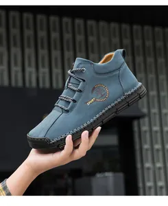 Detail view of handmade stitching on blue men's outdoor casual high-top leather boots