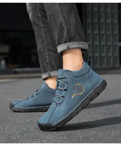 Detailed view of deep blue nubuck men shoes with hand-stitched soles and sport logo