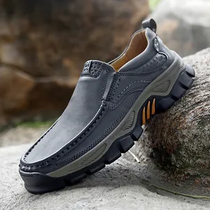 Outdoor men's charcoal leather casual shoes with thick rubber grip soles on rocks