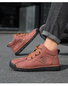 Detail of hand-stitched leather upper and rugged rubber sole on men's outdoor boots