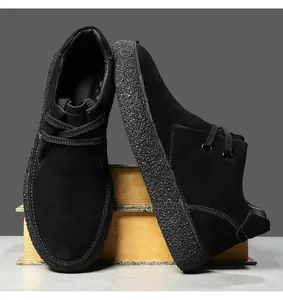 Detail of black suede casual shoes with thick textured sole and retro lace-up design