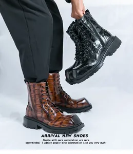 Detail showing crocodile embossed leather texture and side zipper on men's combat boots