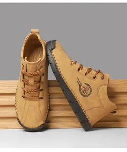 Close-up of men's leather casual boots with hand-stitched soles and side zipper details