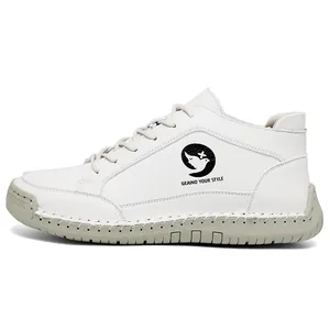 White leather casual shoes for women with soft soles and decorative stitching accents