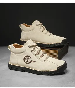Detail view of beige outdoor shoes with hand-stitched rubber soles and fashion logo