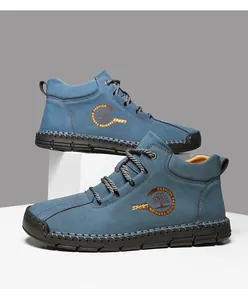Close-up of blue outdoor leather shoe with rugged hand-stitched rubber sole and side logo