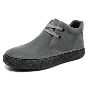 Detail of grey suede leather upper with metallic eyelets and thick textured non-slip sole