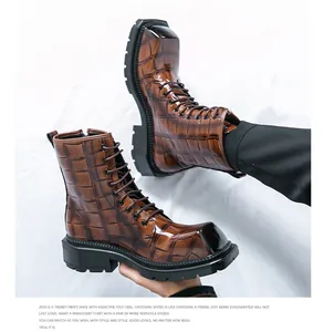 Detail of brown crocodile pattern martin boots with thick sole and zipper