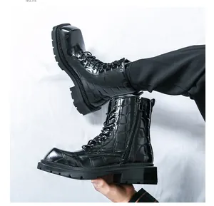 Detail of black crocodile texture leather Martin boots with thick platform and square toe