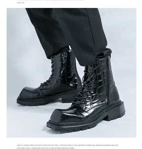 Detail of black crocodile texture leather square toe men boots with lace-up finish