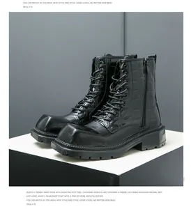 Detail of black martin boots featuring crocodile pattern leather and side zipper