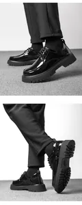 Detail view of mens black patent leather loafers with thick non-slip rubber platform sole