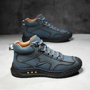 Botas de exterior para hombre en ante azul con cuello de cuero marrón y pespuntes moda