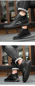 Detail of hand-stitched seams and durable rubber sole on black leather outdoor men's boots