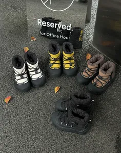 Waterproof children's snow boots in four colors with non-slip thick rubber soles and drawstrings